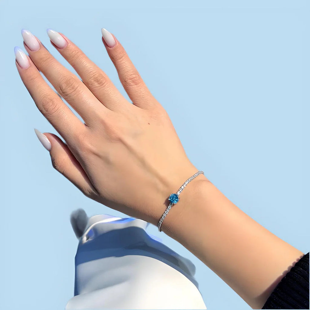 Elegant Silver Tennis Bracelet with Blue Crystal Centerpiece